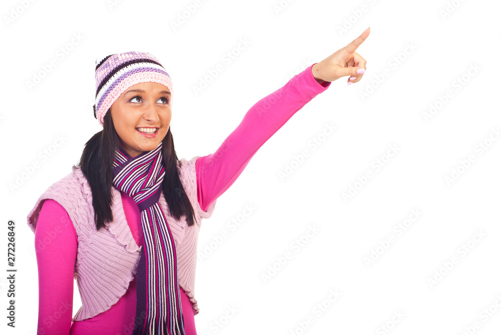 Beauty girl in winter clothes pointing Beauty girl in winter clothes pointing