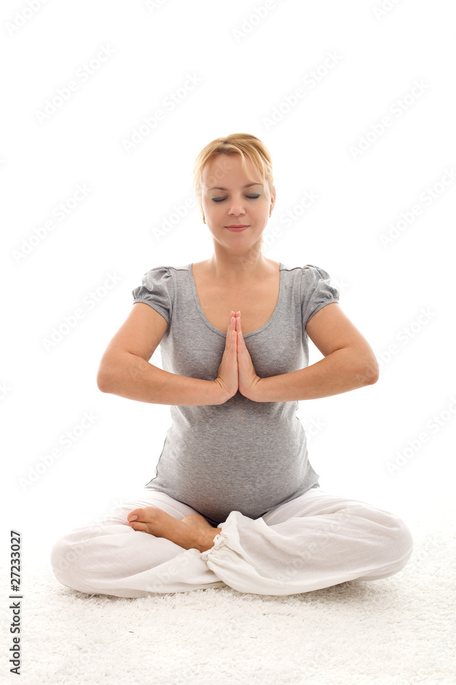 Pregnant woman doing exercises on the floor Pregnant woman doing exercises on the floor