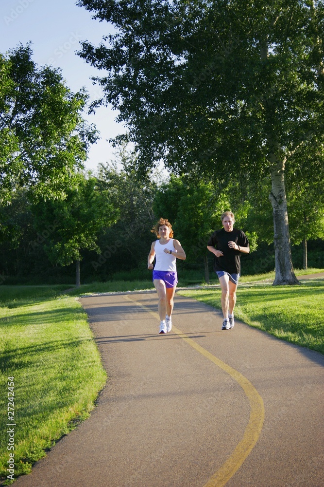 Man And Woman Jogging On Trail Man And Woman Jogging On Trail
