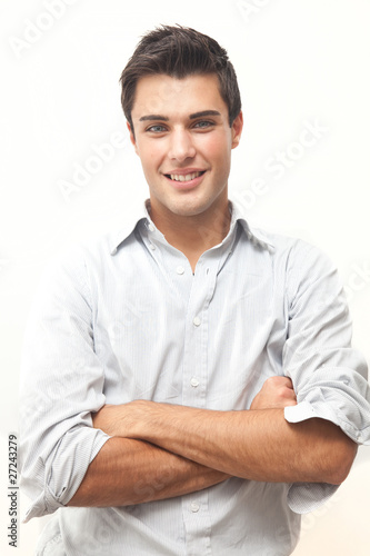 Handsome smiling guy isolated on white © Minerva Studio