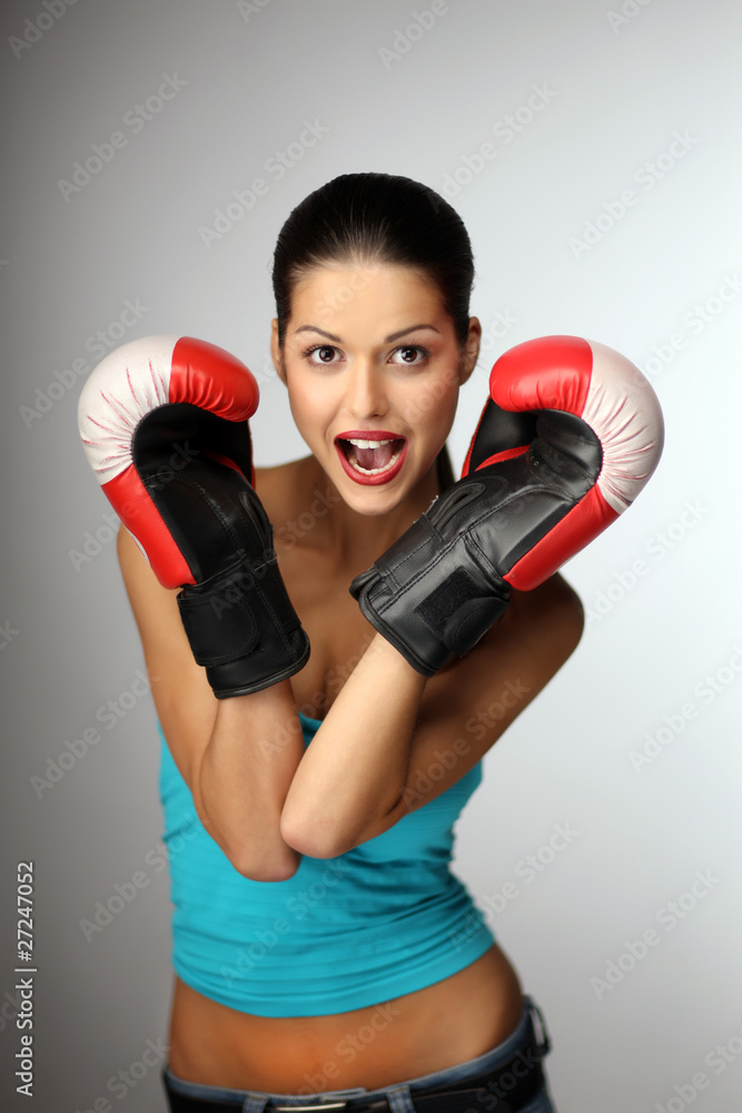 Young beautiful women wiht boxing gloves.