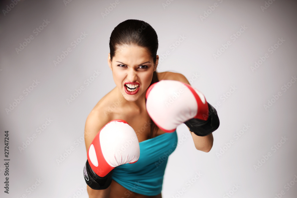 Young beautiful women wiht boxing gloves. Young beautiful women wiht boxing gloves.