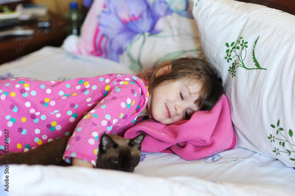 Girl and the cat in the bed Girl and the cat in the bed