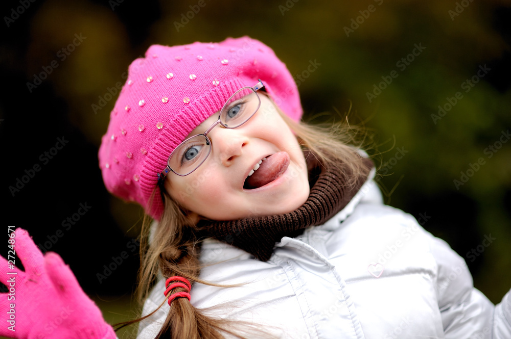 Adorable small girl in bright pink hat Adorable small girl in bright pink hat