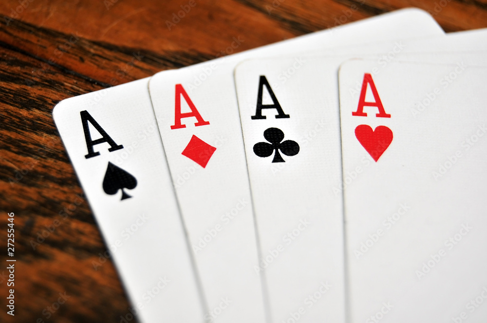 Obraz premium Four Aces - Playing Cards on Wooden Table