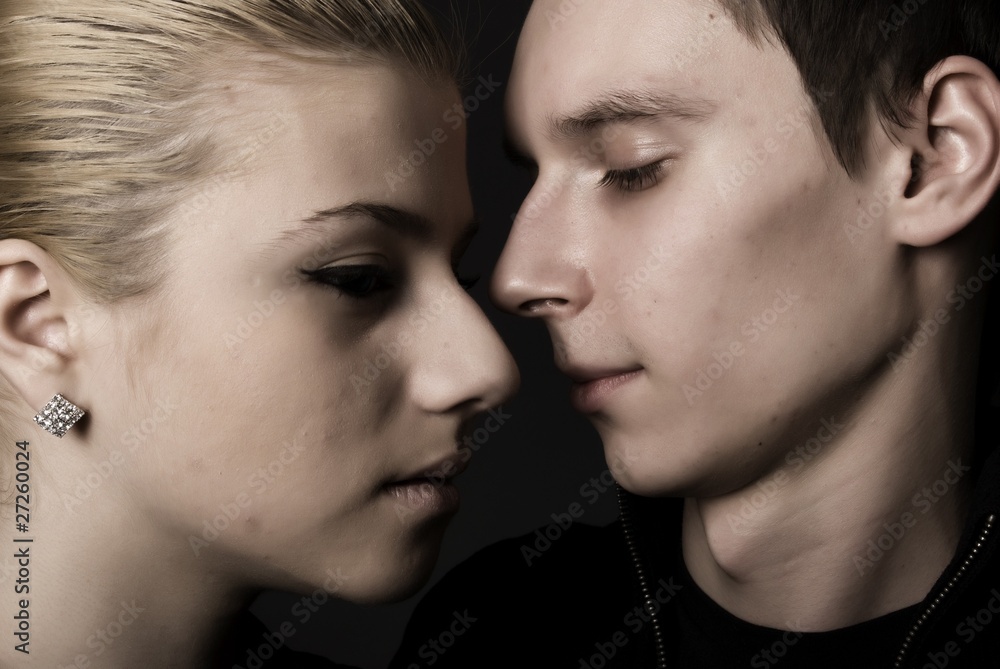 close-up of young couple looking at each other close-up of young couple looking at each other