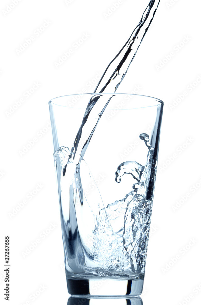 Pouring water into glass isolated on white background Pouring water into glass isolated on white background