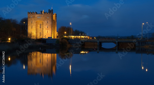 beautiful night time irish castle by water