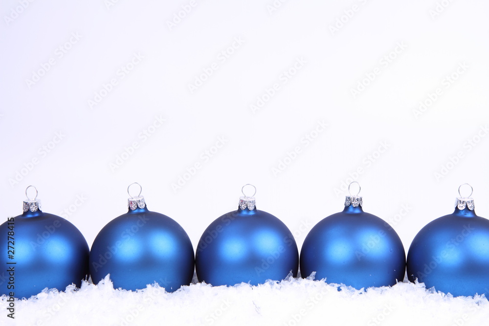 Blue matt christmas balls on snow, with space for your text Blue matt christmas balls on snow, with space for your text