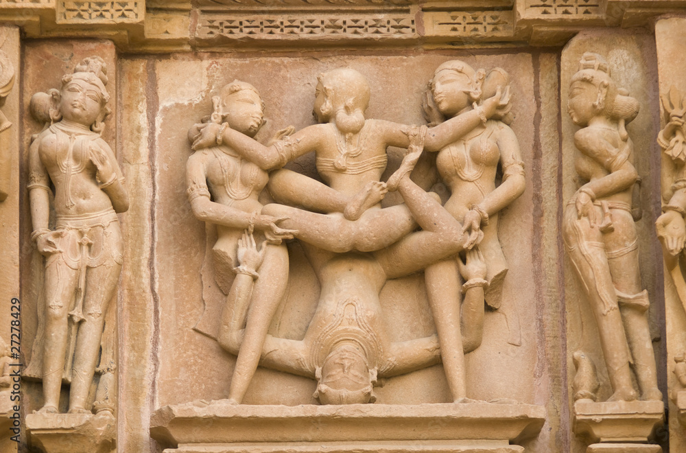 Erotic sculptures on  Hindu Temple at Khajuraho, India.