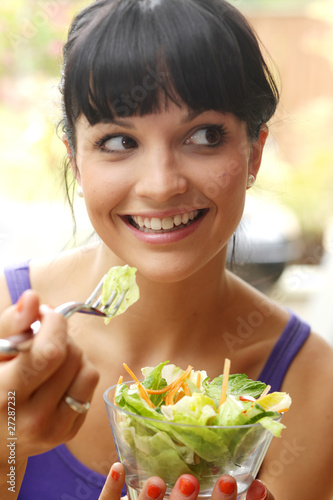 Young Woman Eating Salad. Model Released