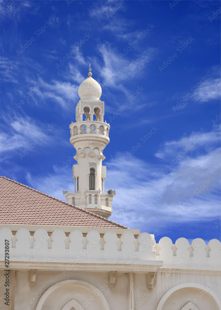 Minaret of Sheikh Isa Bin Ali Mosque on blue sky