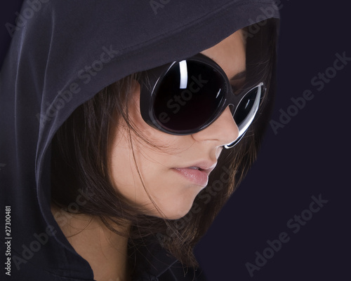 Young sexy woman in sunglasses with hood. photo