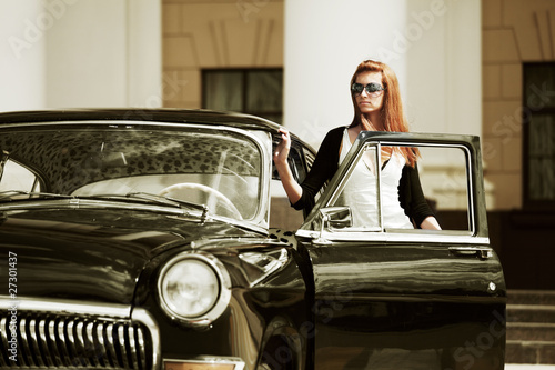 Young woman with a retro car.