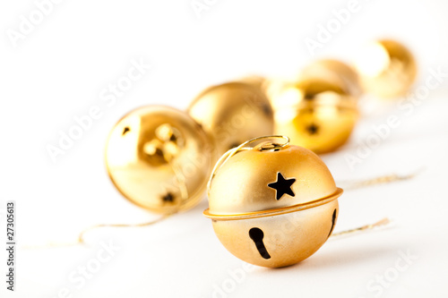 Golden Christmas baubles on white