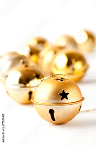 Golden Christmas baubles on white