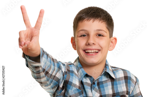 Happy boy showing a victory sign