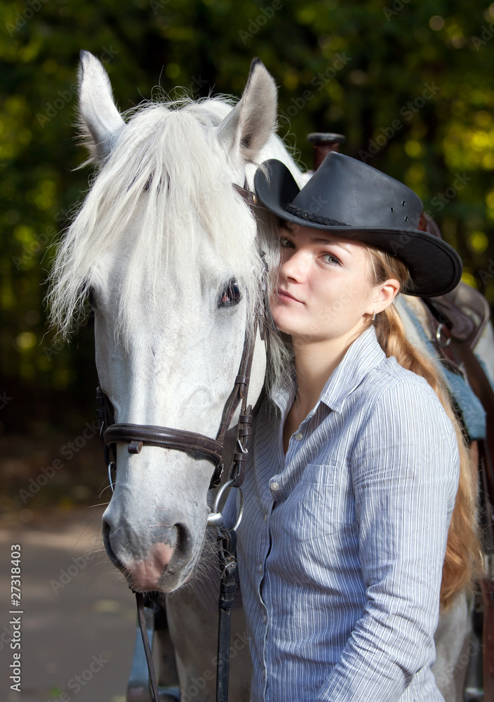 Fototapeta premium Young Lady hugging her horse