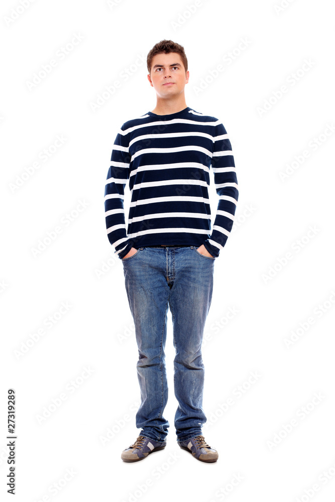 Young man standing firmly with hands in pockets Young man standing firmly with hands in pockets