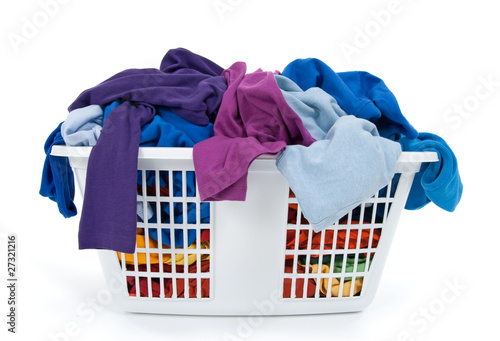 Canvas Print Colorful clothes in laundry basket. Blue, indigo, purple.