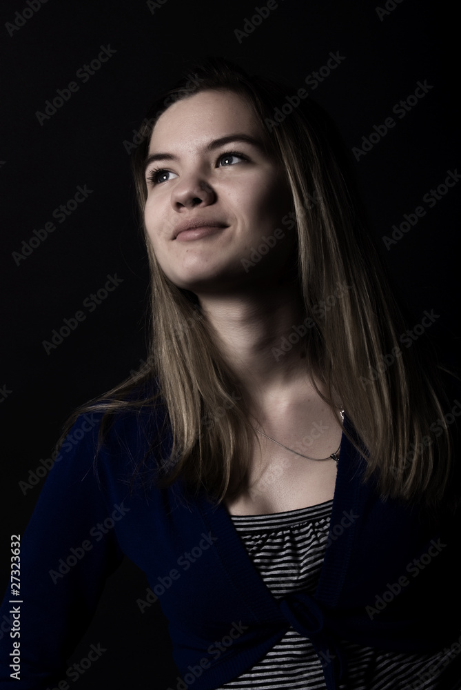 Fototapeta premium Portrait of a young girl looking somewhere