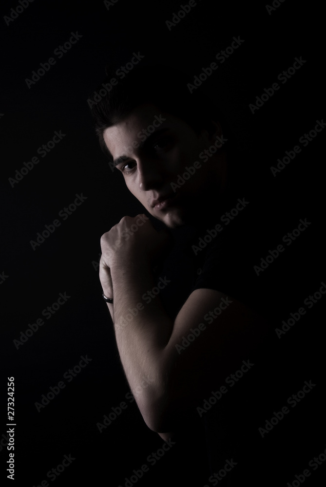 portrait of a young man in the darkness portrait of a young man in the darkness