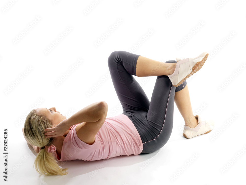 Obraz premium Young Woman Doing Sit Ups. Model Released