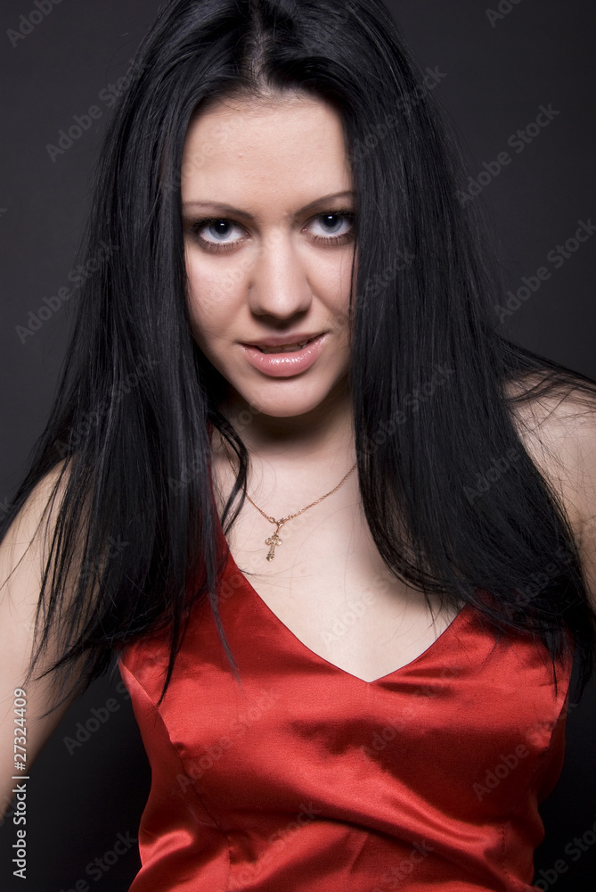 Portrait of a young girl in red posing Portrait of a young girl in red posing