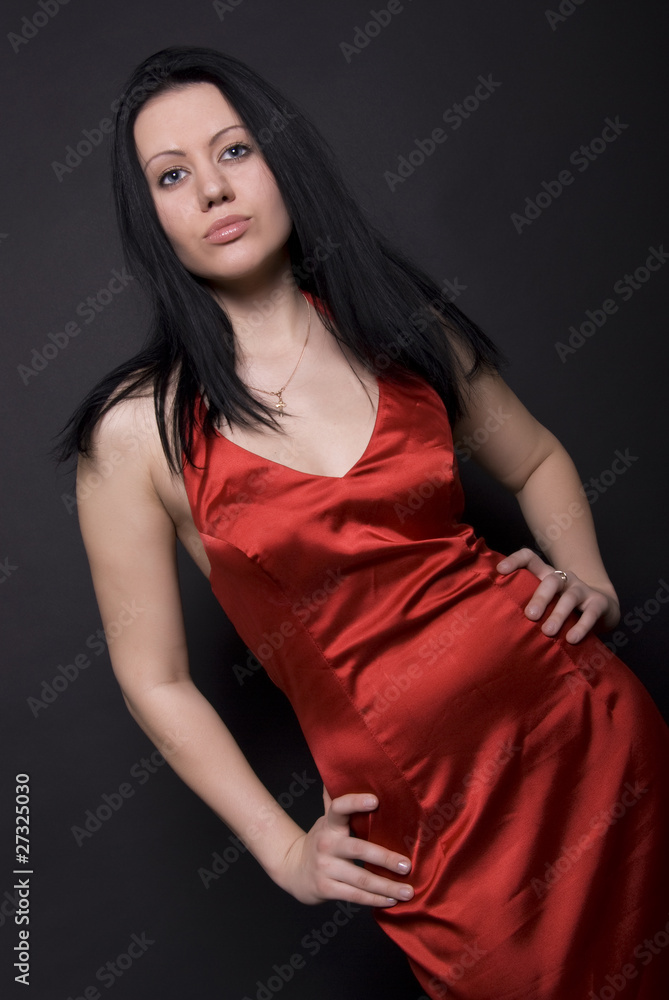 Portrait of a young brunette in red posing Portrait of a young brunette in red posing