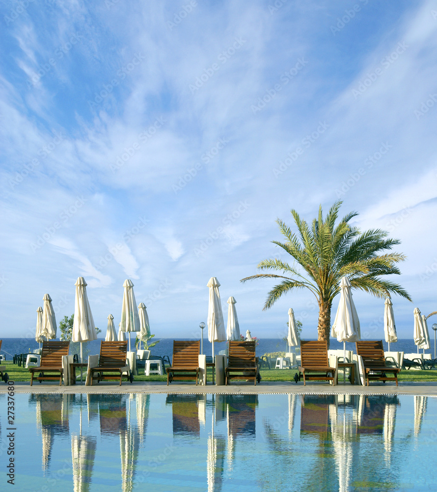 Fototapeta premium Image of a beautiful resort background with water and palms