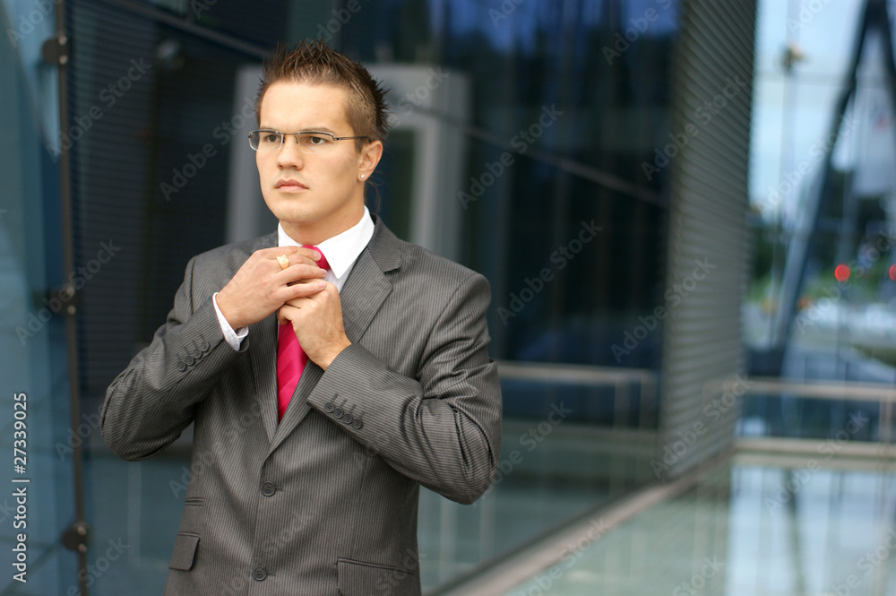 A young and handsome businessman in formal clothes A young and handsome businessman in formal clothes