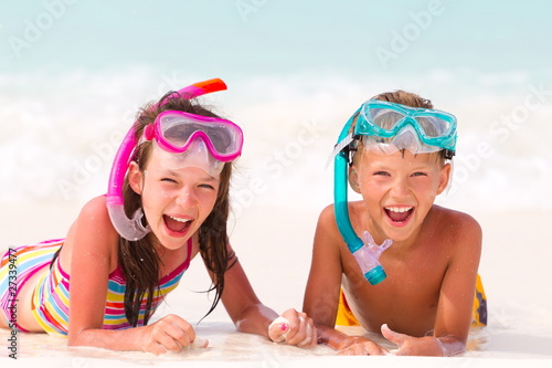 Happy boy and girl on beach
