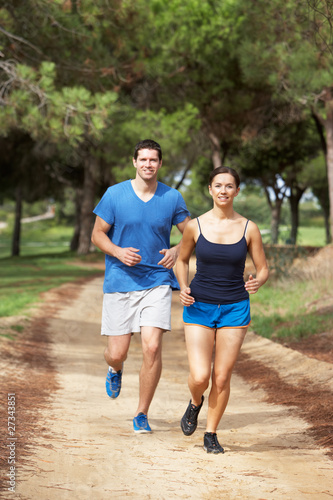 Couple running in park