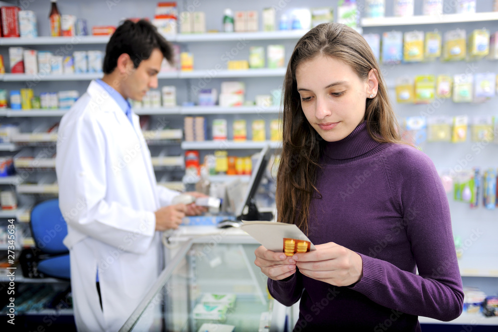 Consumer with medicine at pharmacy Consumer with medicine at pharmacy