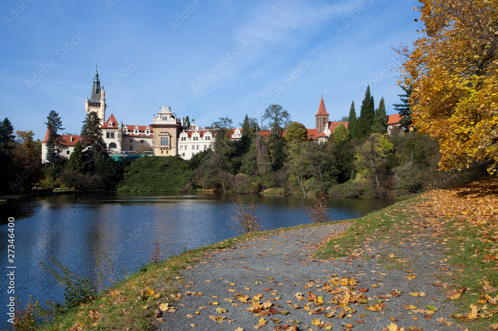 beautiful autumn landscape with colorful trees, a pond and a med
