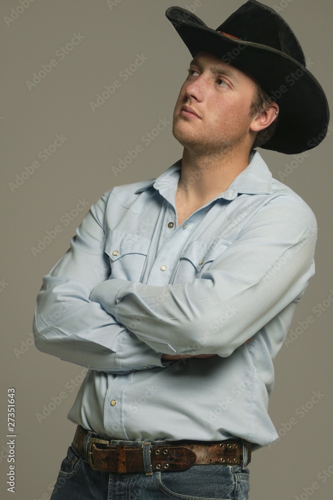 Young Man Wearing Western Wear With Arms Crossed Young Man Wearing Western Wear With Arms Crossed