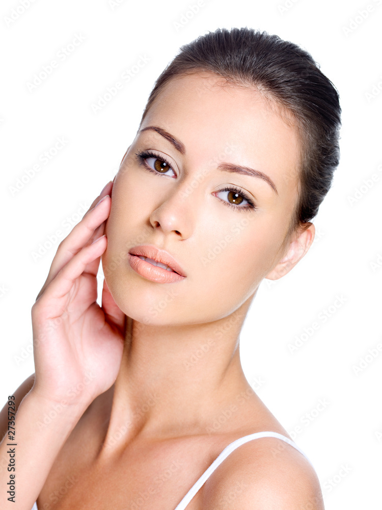 beautiful young woman touching her clean skin on face beautiful young woman touching her clean skin on face