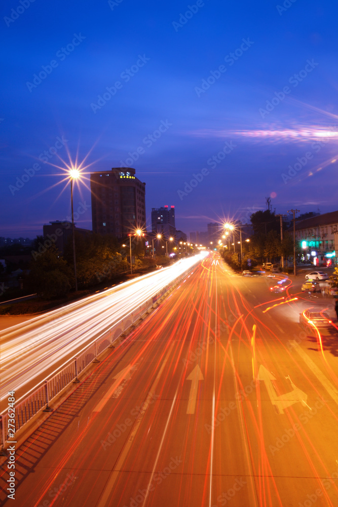 city highway at night with light trails