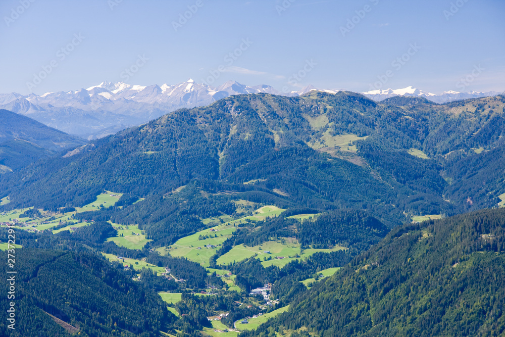 a view from the top of the alpine peak in the summertime