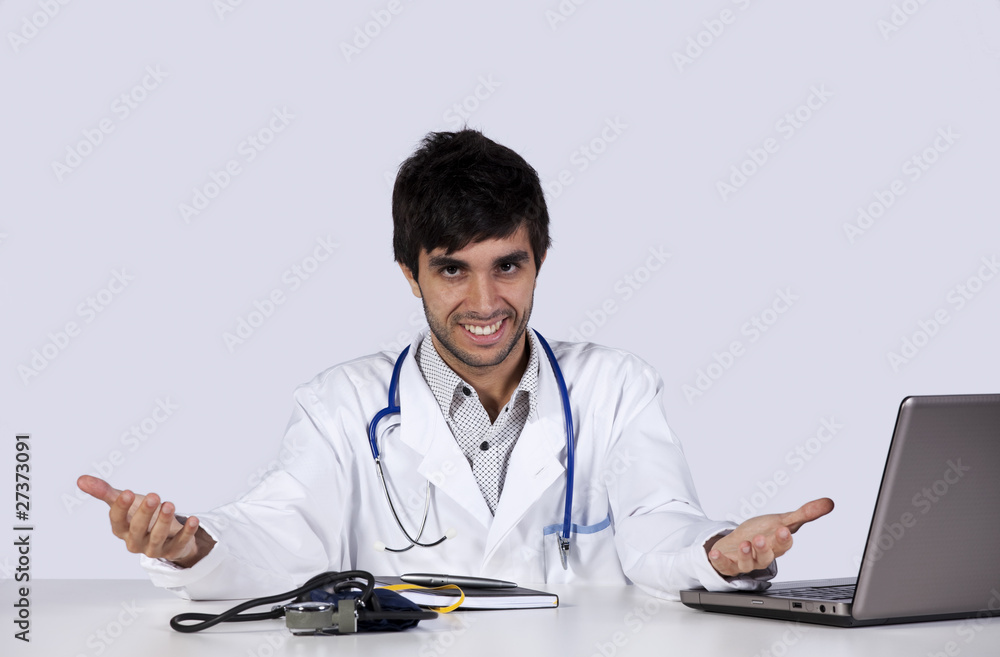 frendly young doctor at his office frendly young doctor at his office