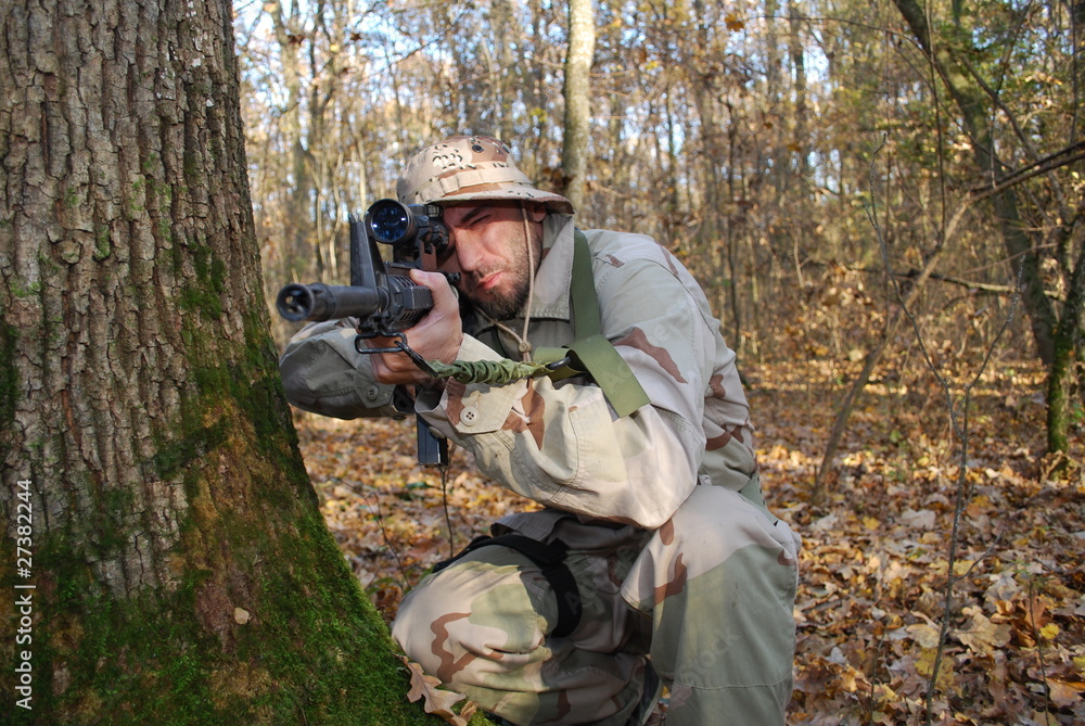 Marine soldier aiming the enemy Marine soldier aiming the enemy