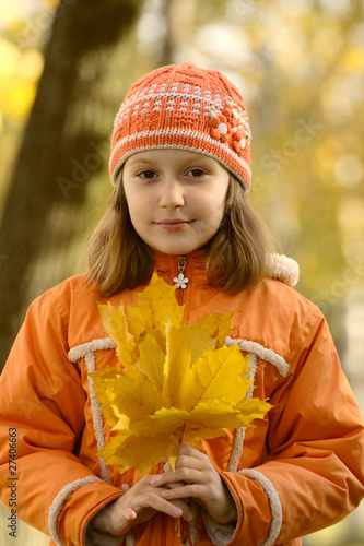 girl with yellow maple leaves