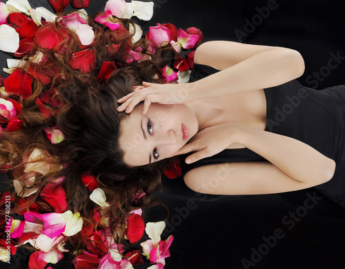 beautiful brunette in rose petals