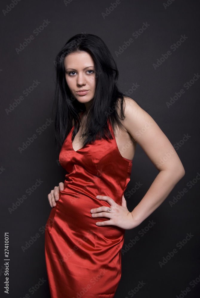 Portrait of a young seductive brunette in red Portrait of a young seductive brunette in red