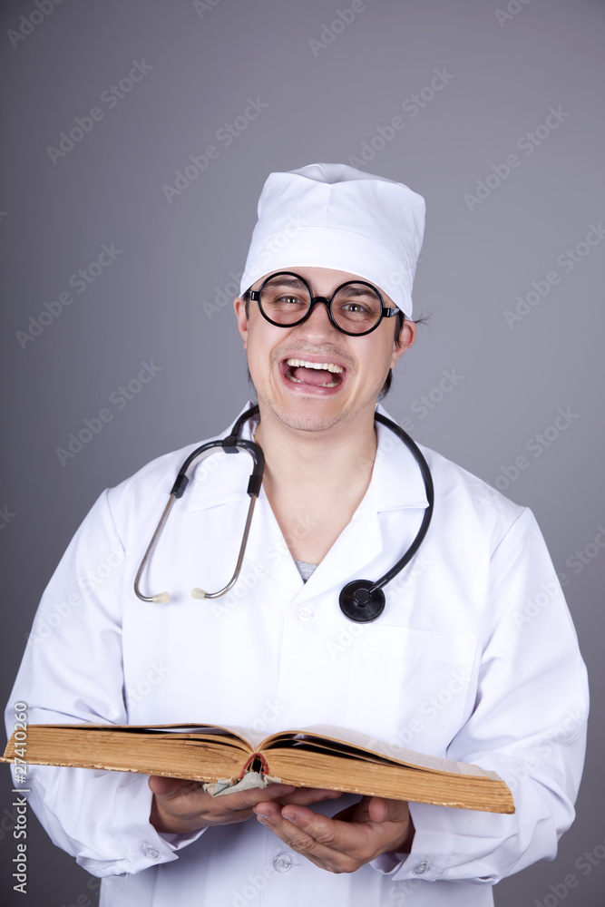 Young doctor with book.