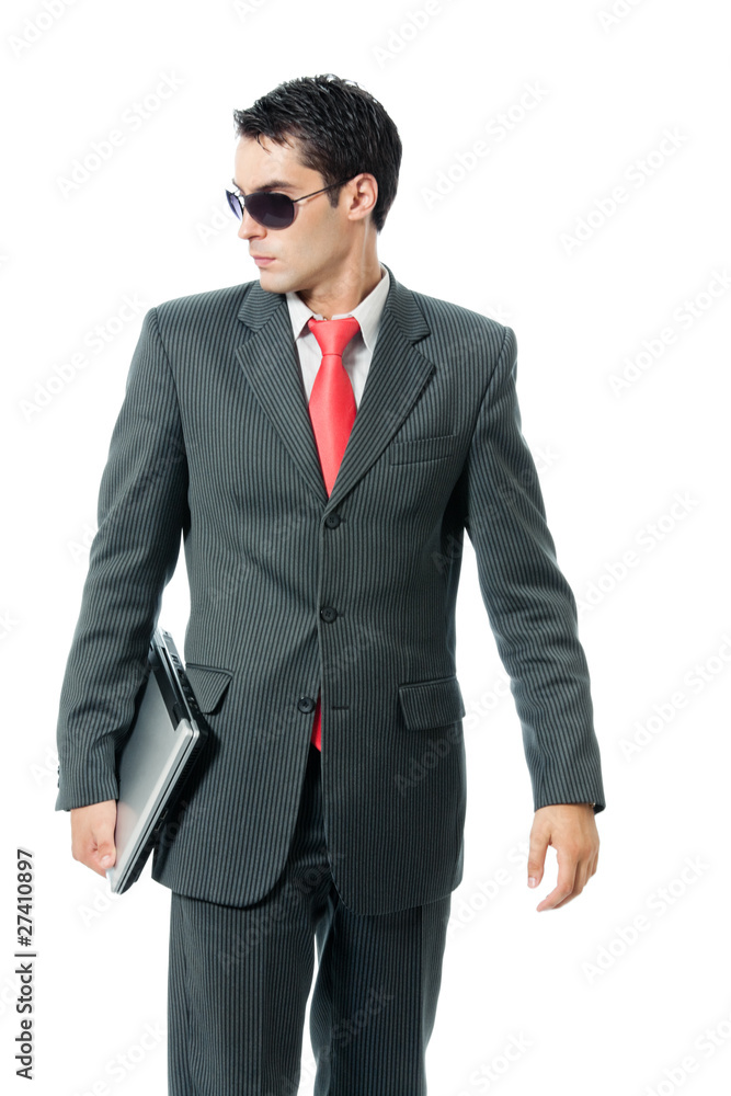 Businessman or hacker in sun glasses with laptop, isolated Businessman or hacker in sun glasses with laptop, isolated