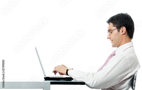 Successful happy smiling businessman working with laptop