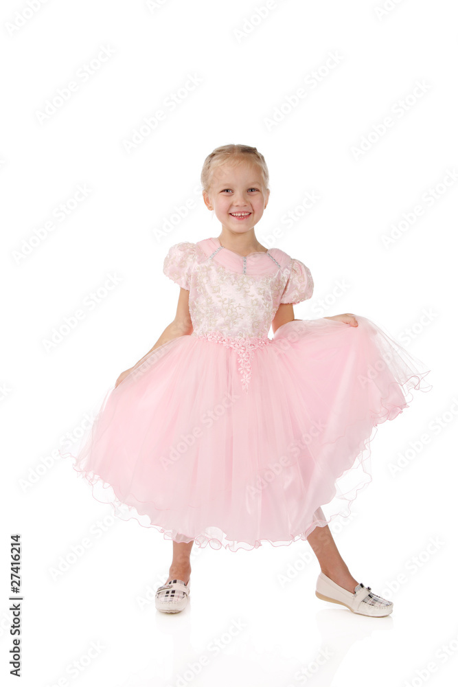 little girl in a pink elegant dress.White background little girl in a pink elegant dress.White background