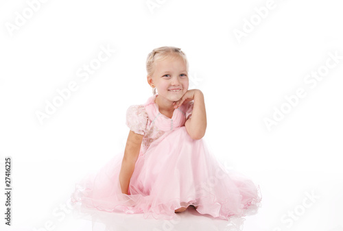 little girl in a pink elegant dress.White background