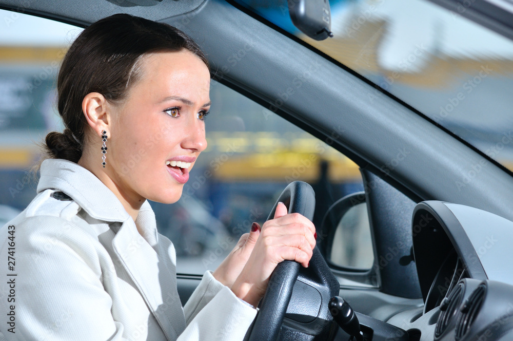 happy business woman in a car is looking at camera happy business woman in a car is looking at camera